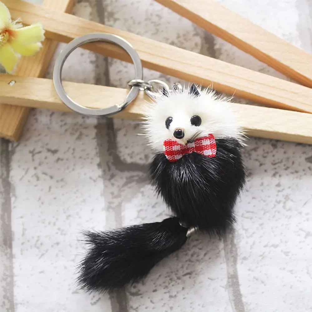 Set of plush fur keychains in assorted colours